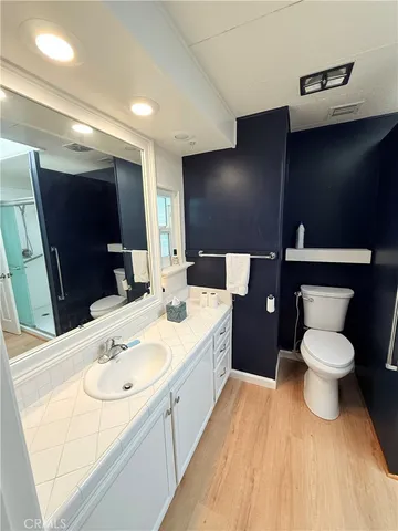 an empty room with a fireplace and a large window