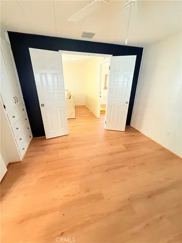 a view of an empty room with a fireplace