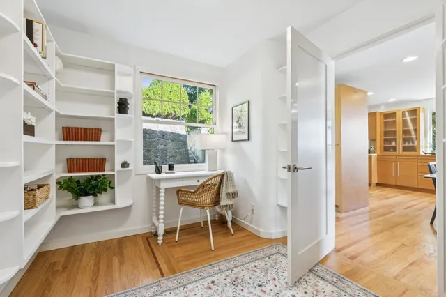 a living room with furniture and a table