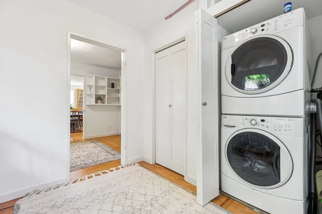 a view of a hallway with washer and dryer
