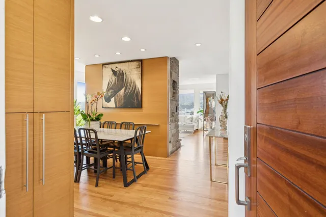 a view of a dining room with furniture and wooden floor