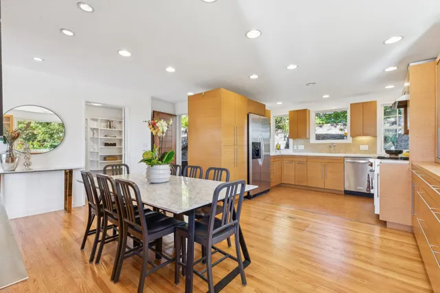 a view of a dining room with furniture and wooden floor