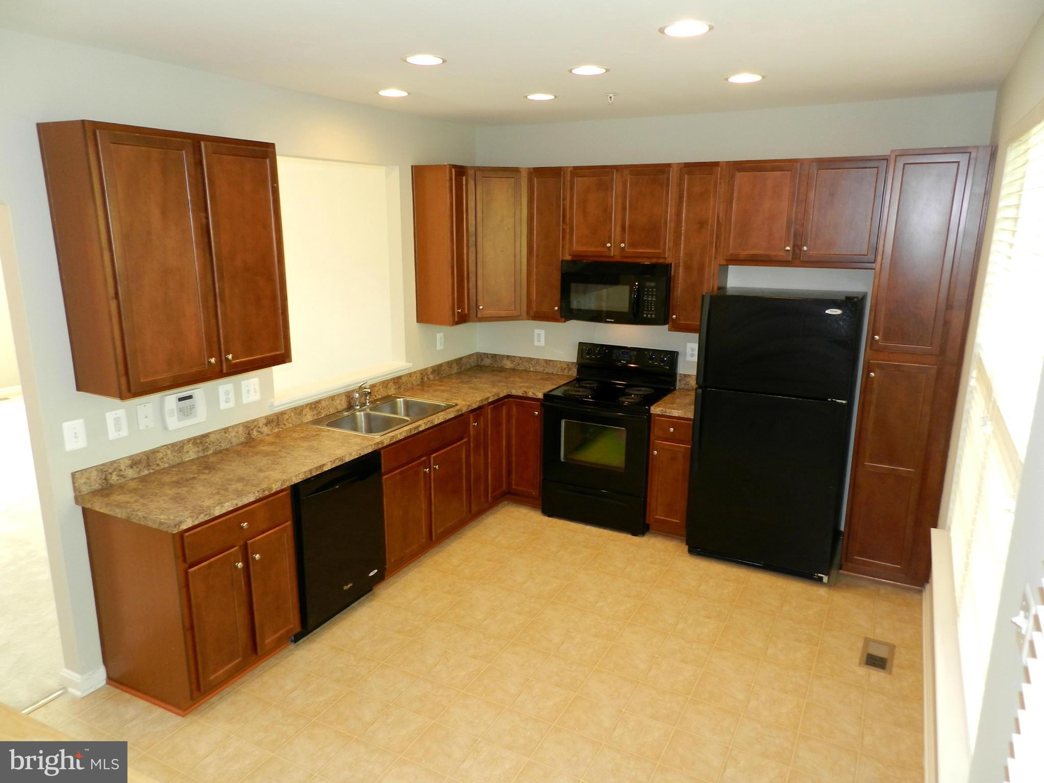 2185 Swains Lock Court Point of Rocks, MD 21777 - Photo 11 of 30 a kitchen with granite countertop stainless steel appliances a refrigerator and a sink