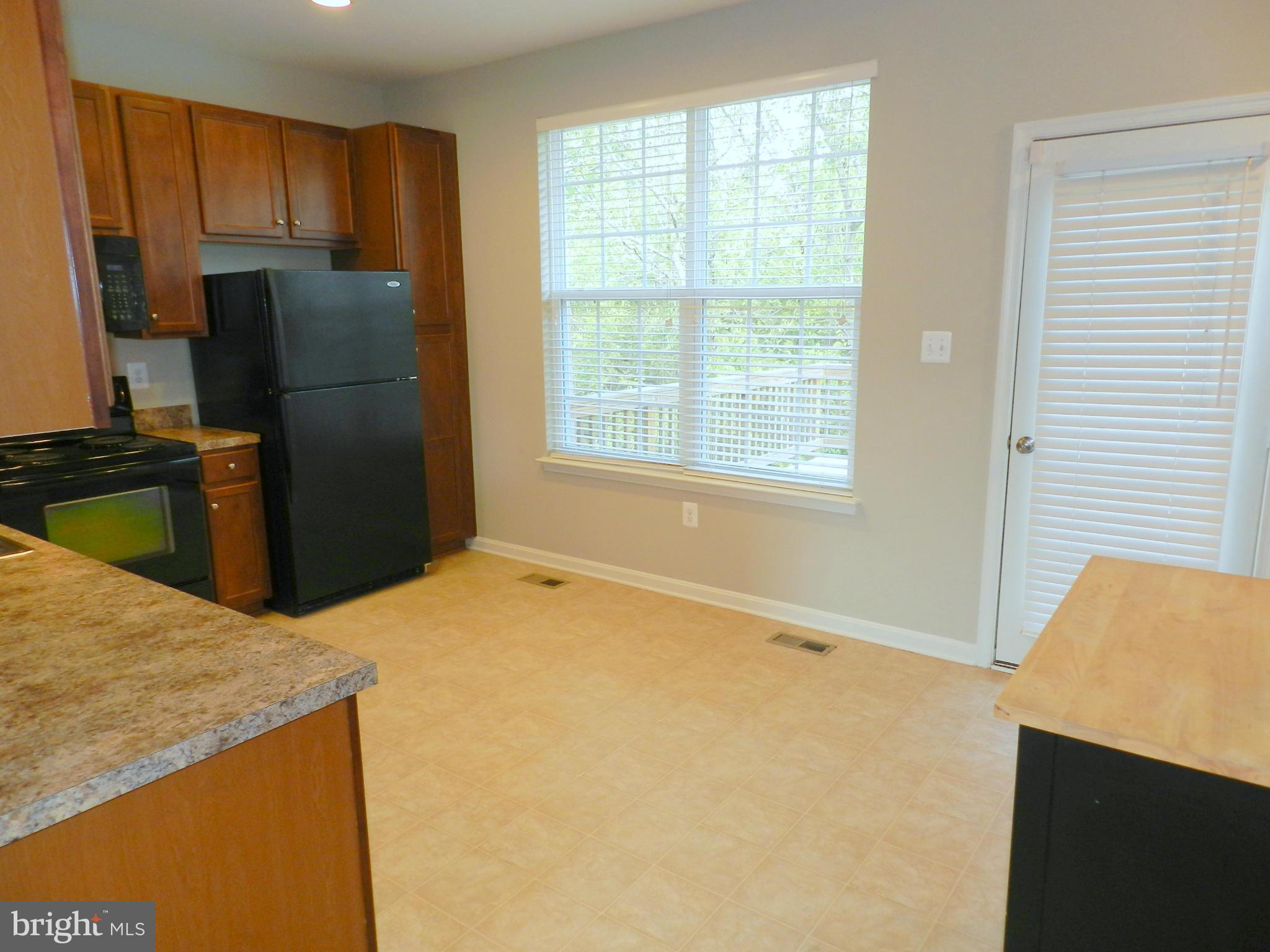 2185 Swains Lock Court Point of Rocks, MD 21777 - Photo 12 of 30 a kitchen with a refrigerator stove and microwave