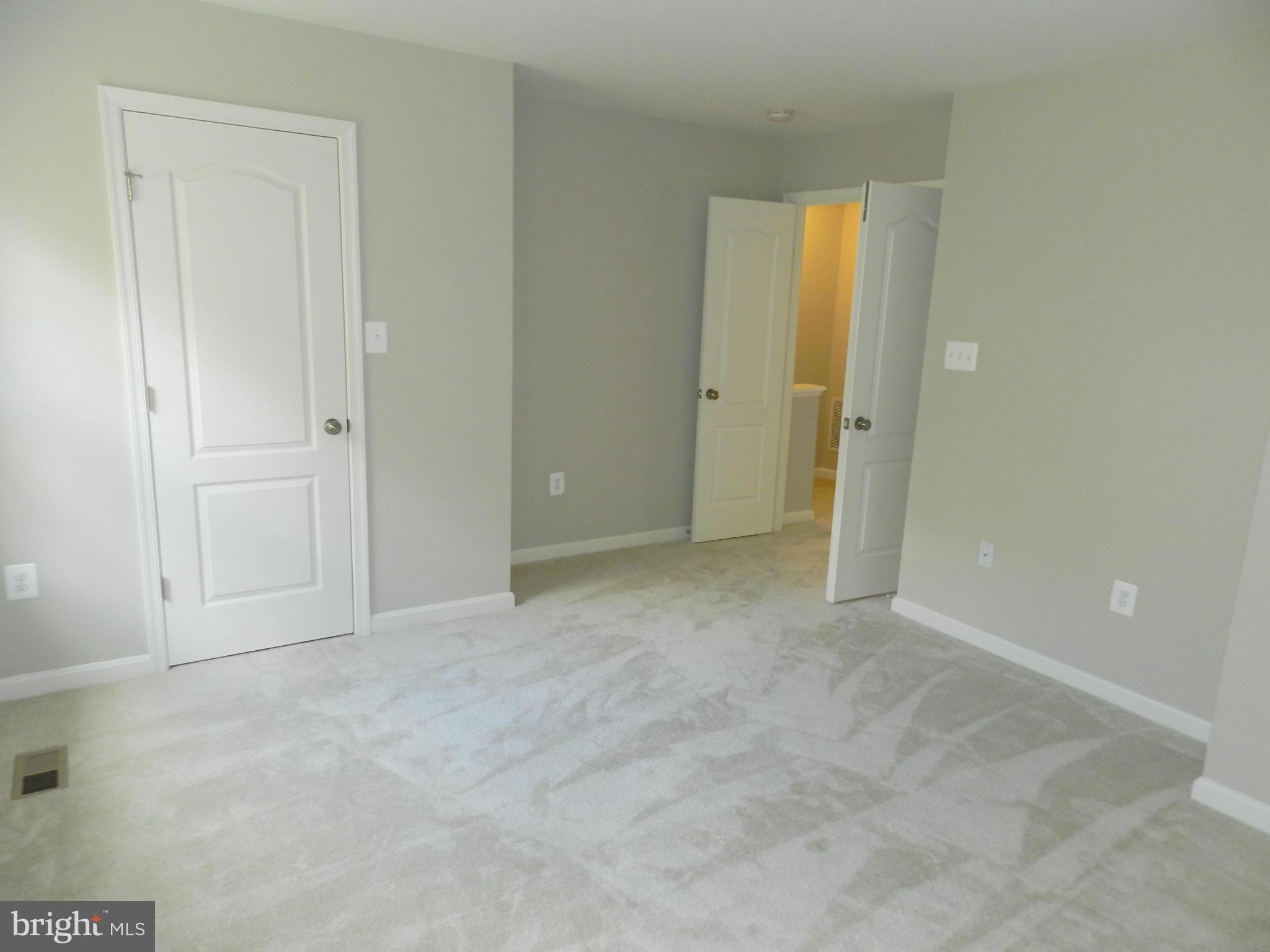 2185 Swains Lock Court Point of Rocks, MD 21777 - Photo 16 of 30 an empty room with windows and closet