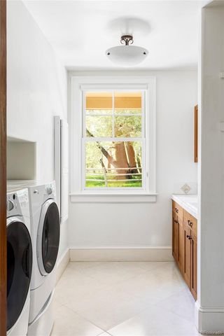a view of livingroom with washer and dryer