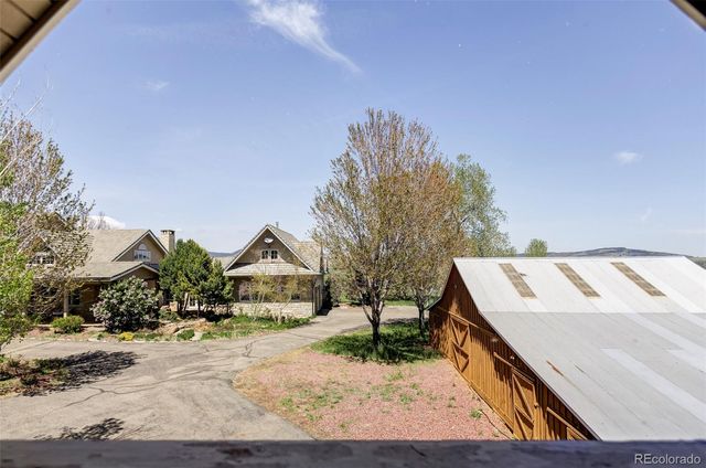 a view of house with wooden fence