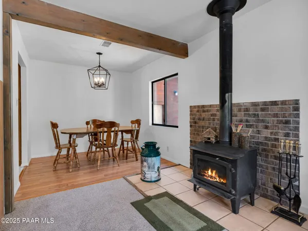 a dining room with furniture and a fireplace