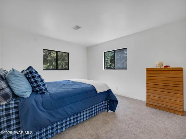 a bedroom with a bed and closet