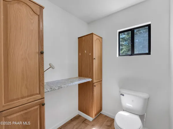 a bathroom with a toilet and a sink