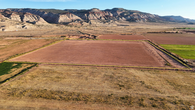 1000 East Mink Farm Road Richfield, UT 84701 - Photo 3 of 29 Expansive agricultural land featuring a tilled field, an irrigated field, and surrounding natural terrain