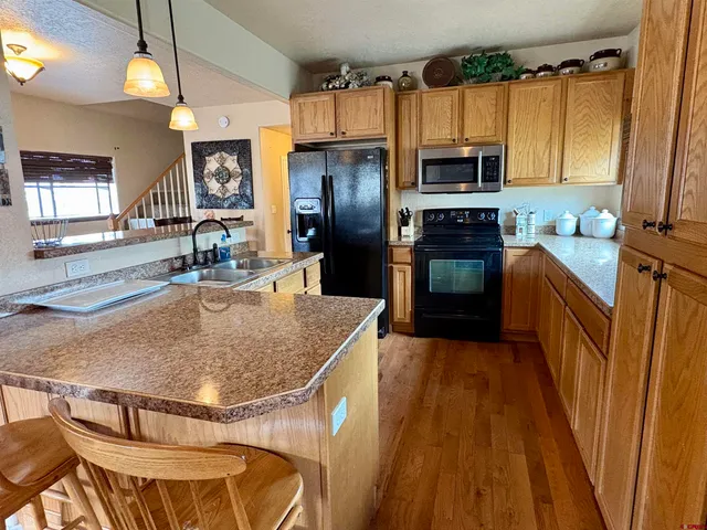 a living room with furniture windows and a flat screen tv