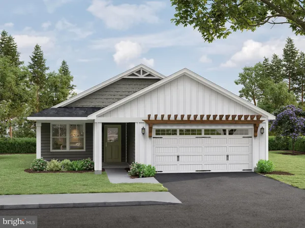 a front view of a house with a garden and garage