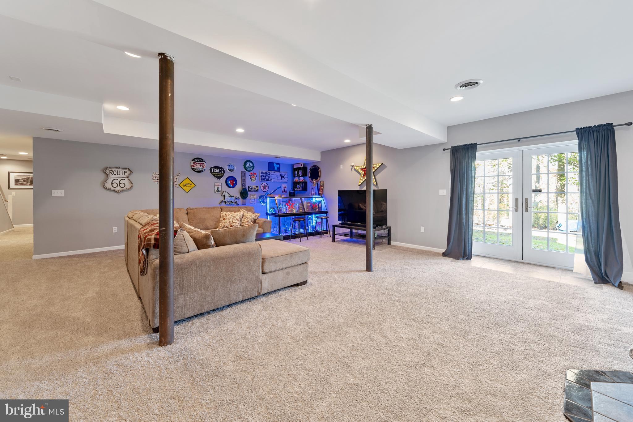 15 Warner Woods Road Elkton, MD 21921 - Photo 45 of 58 Large basement rec room w/ walkout & pellet stove