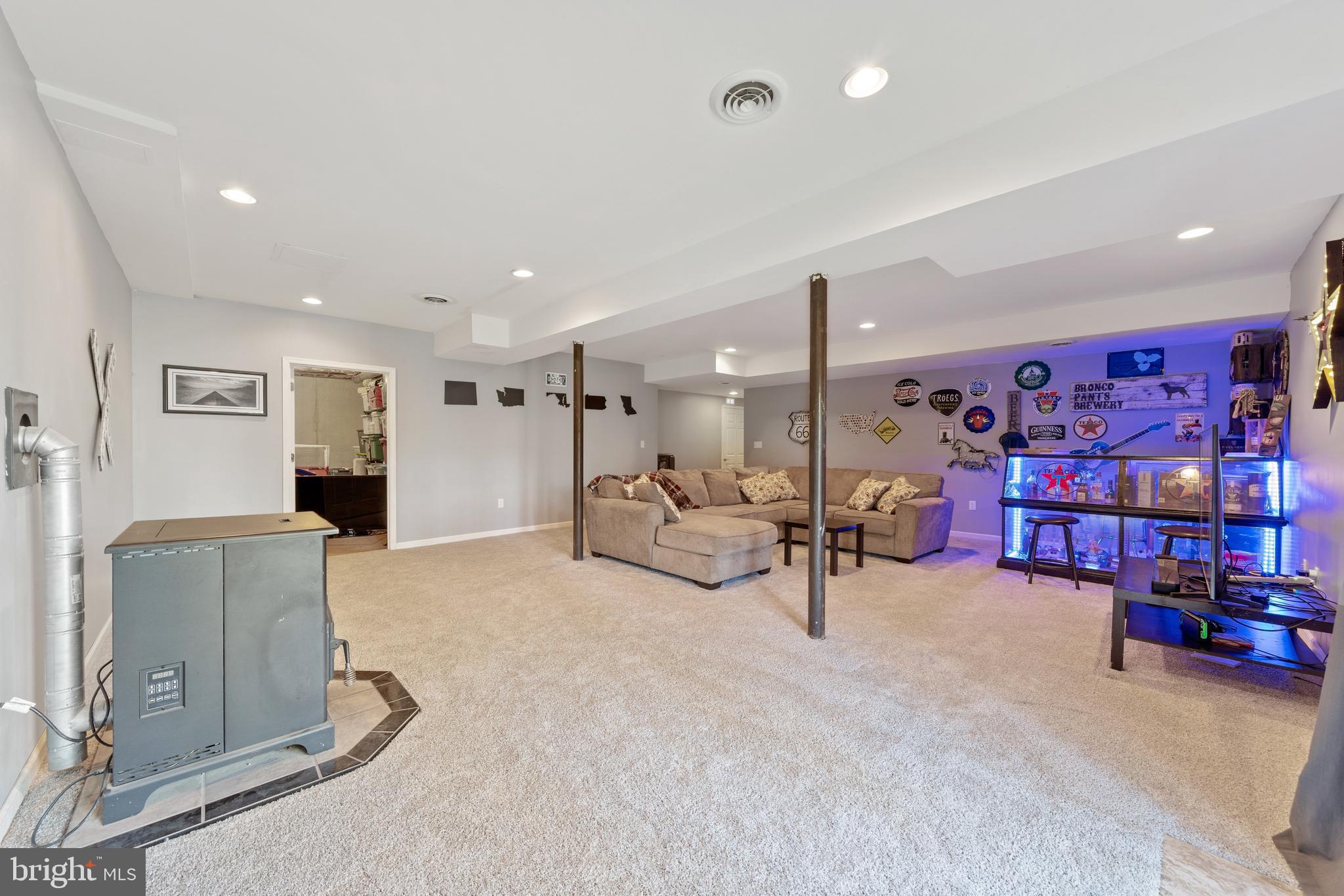 15 Warner Woods Road Elkton, MD 21921 - Photo 46 of 58 Large basement rec room w/ walkout & pellet stove
