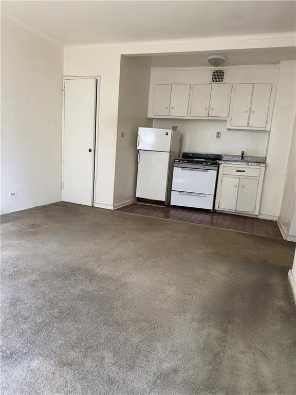 9430 Ridge Boulevard, Unit 1H Brooklyn, NY 11209 - Photo 2 of 7 a view of kitchen with white cabinets