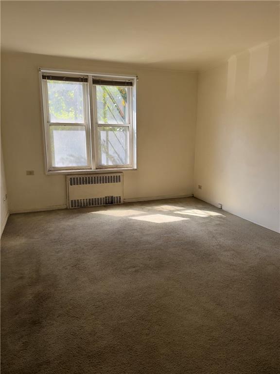 9430 Ridge Boulevard, Unit 1H Brooklyn, NY 11209 - Photo 4 of 7 an empty room with a window