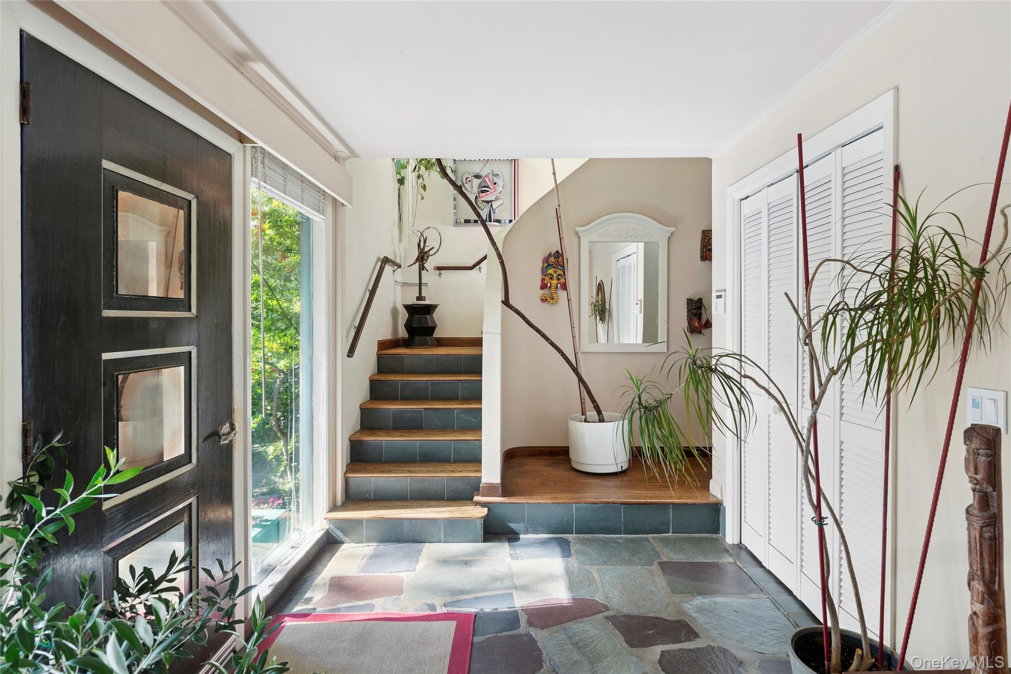 3700 Haywaters Road Cutchogue, NY 11935 - Photo 4 of 22 Foyer entrance featuring stone tile flooring and stairway