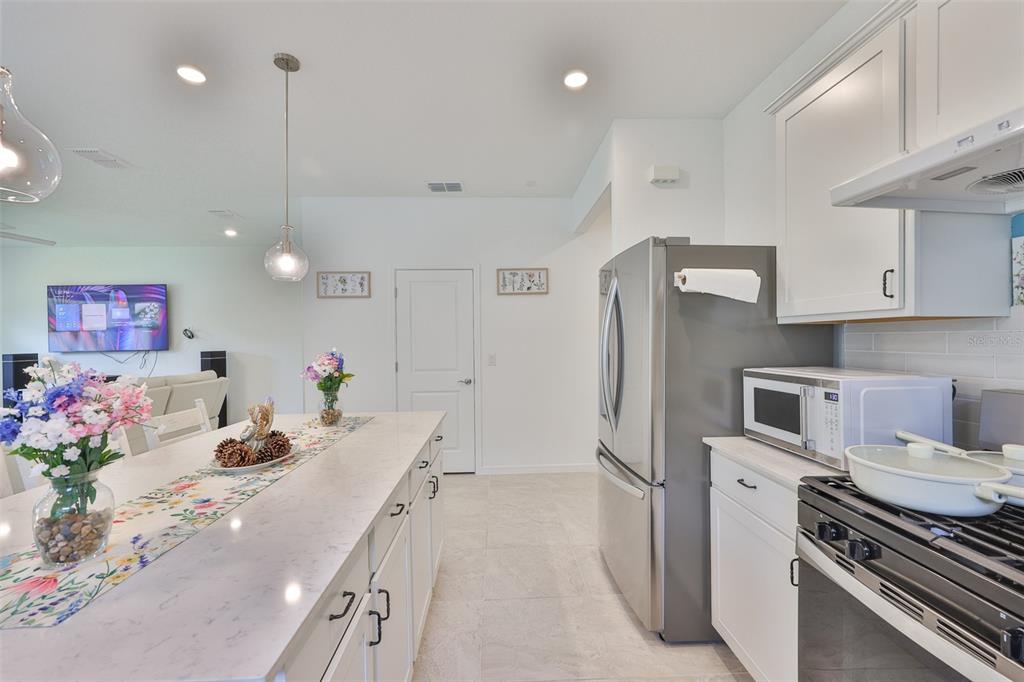 2948 Frst Mdw Avenue Valrico, FL 33594 - Photo 13 of 16 a kitchen with a sink stainless steel appliances and cabinets