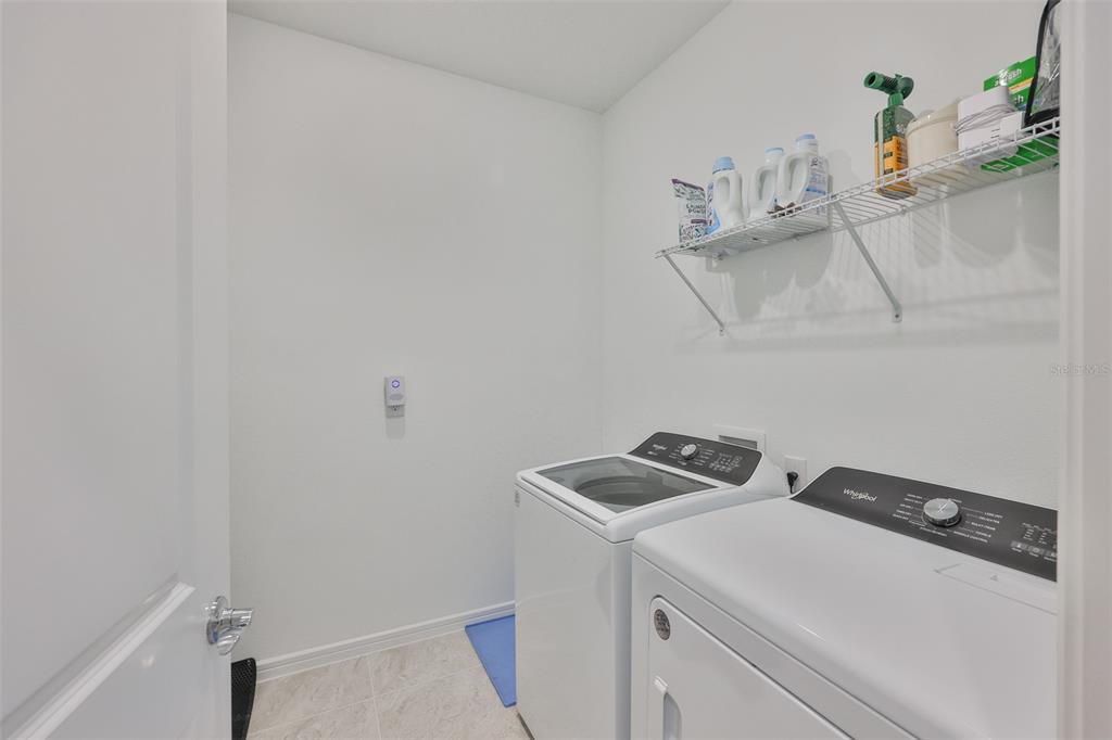 2948 Frst Mdw Avenue Valrico, FL 33594 - Photo 15 of 16 a utility room with dryer and washer