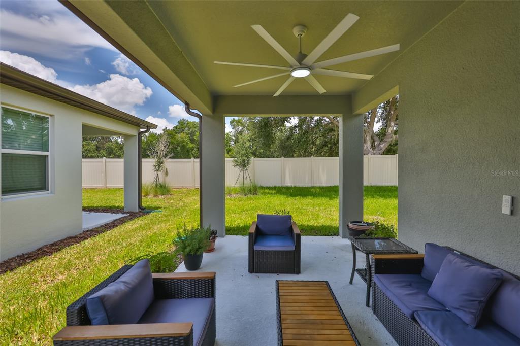 2948 Frst Mdw Avenue Valrico, FL 33594 - Photo 4 of 16 a view of a patio with couches chairs and potted plants