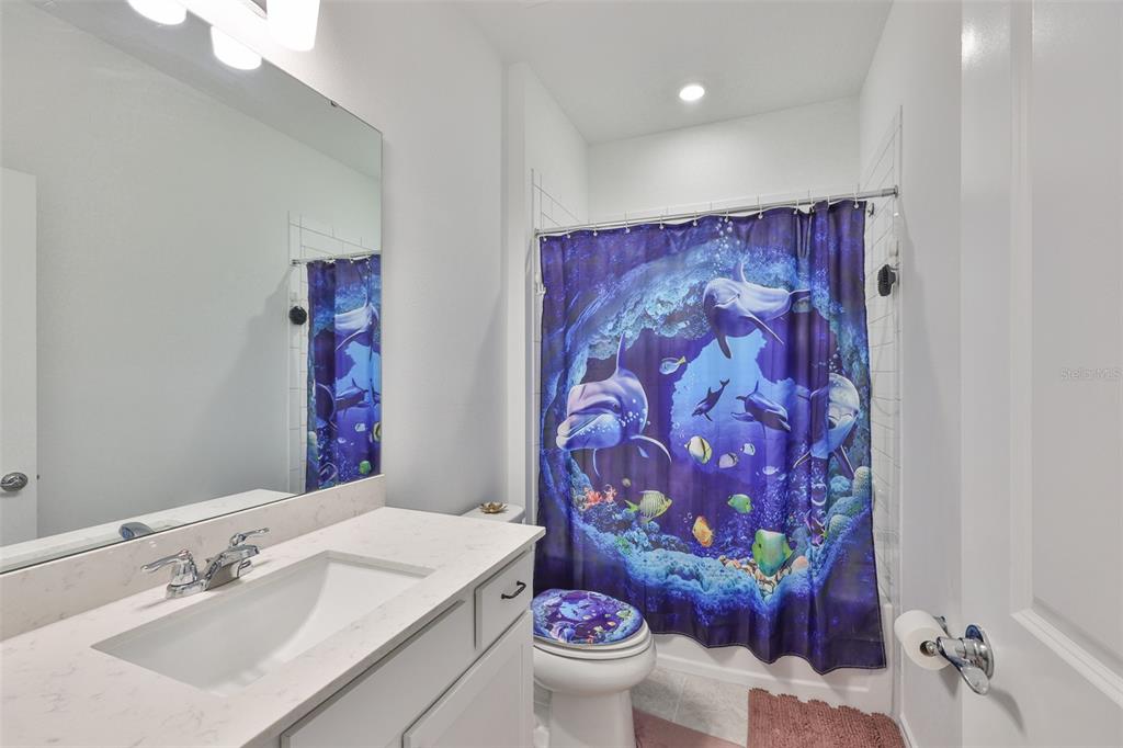 2948 Frst Mdw Avenue Valrico, FL 33594 - Photo 8 of 16 a bathroom with a sink and a mirror