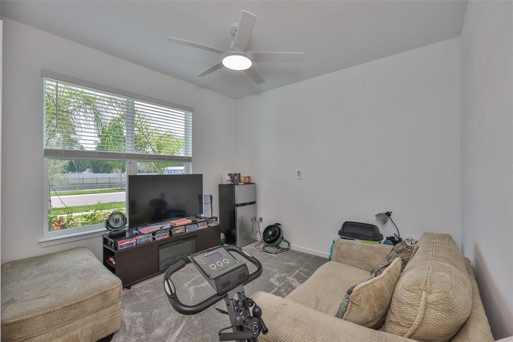 2948 Frst Mdw Avenue Valrico, FL 33594 - Photo 9 of 16 a living room with furniture and a flat screen tv