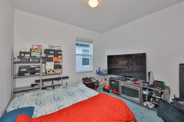 a room with furniture and a flat screen tv