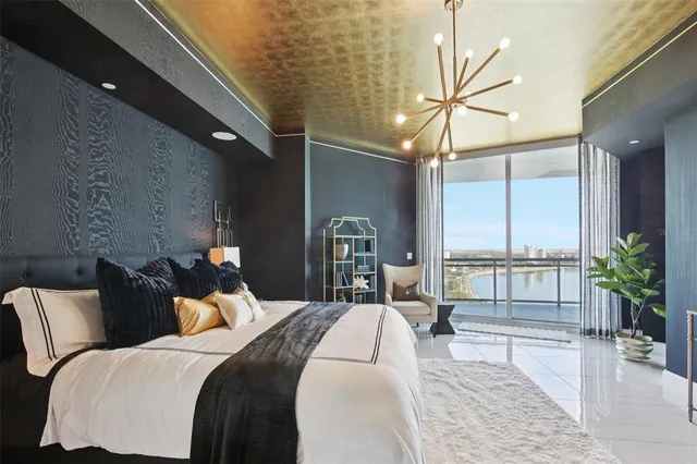 a kitchen with kitchen island granite countertop a table and chairs in it