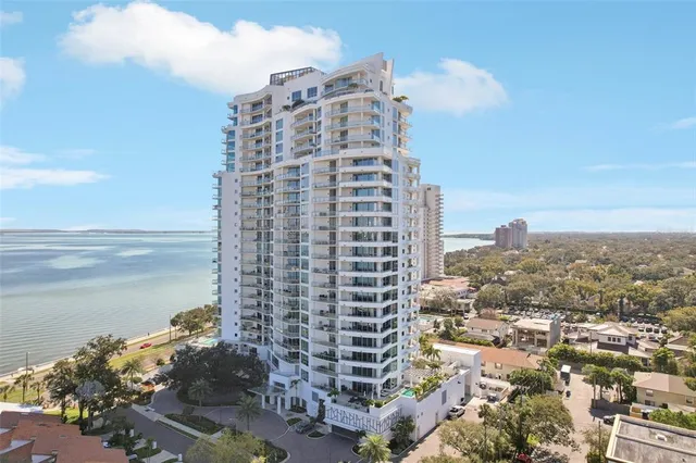 a spacious bedroom with a bed and window