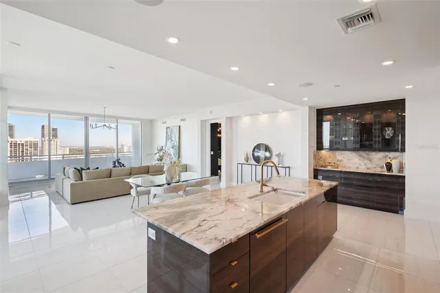 a bed room with a bed and a chandelier