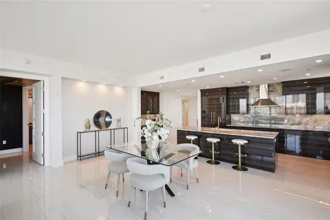 a bed room with a bed and a chandelier