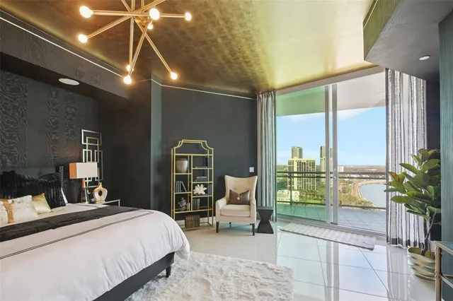 a view of a bathroom with a couple of shower and a sink