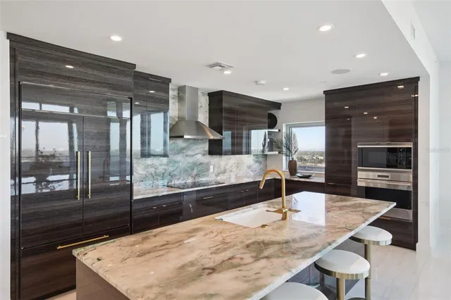 a view of bathroom with mirror and dual sinks
