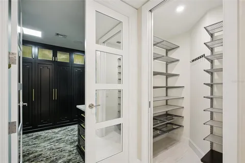 a view of a bathroom with a couple of shower and a sink