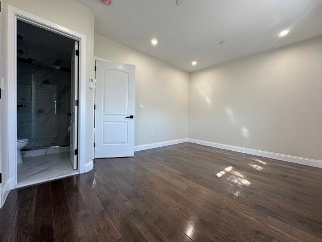 141-14 Booth Memorial Avenue Queens, NY 11355 - Photo 7 of 13 an empty room with wooden floor and door