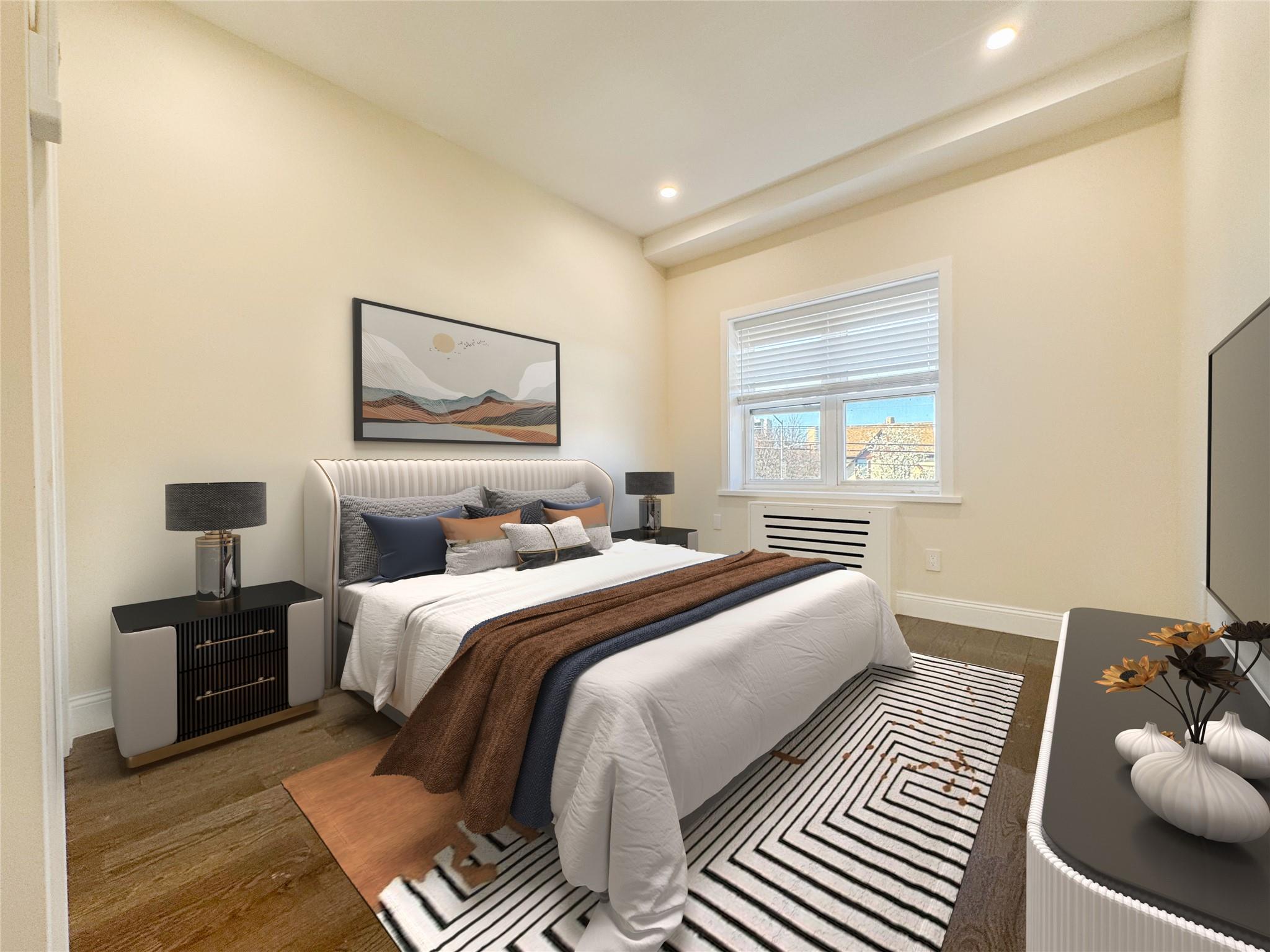 141-14 Booth Memorial Avenue Queens, NY 11355 - Photo 8 of 13 a bedroom with a bed and wooden floor