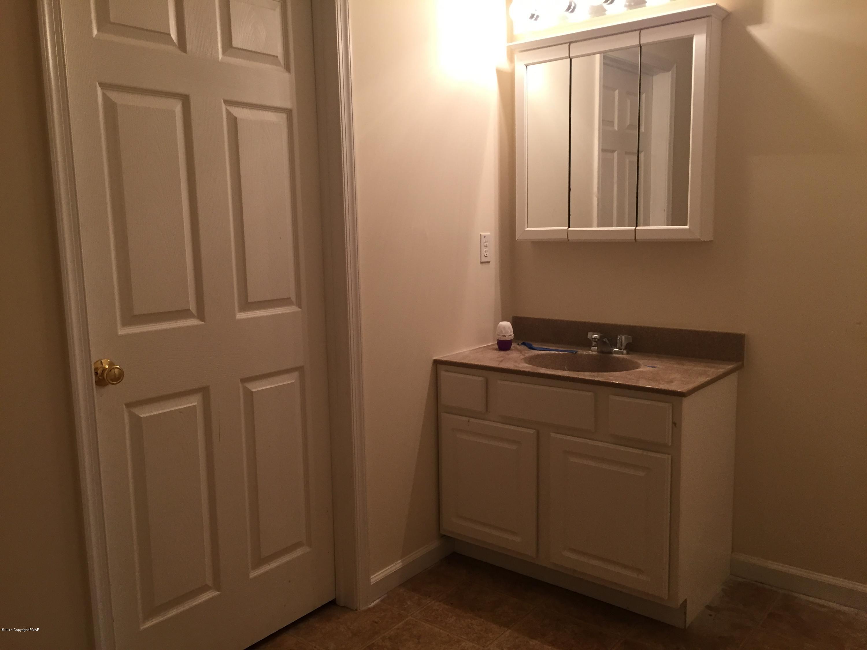 1653 Clover Road North Long Pond, PA 18334 - Photo 12 of 15 a bathroom with a sink and a mirror