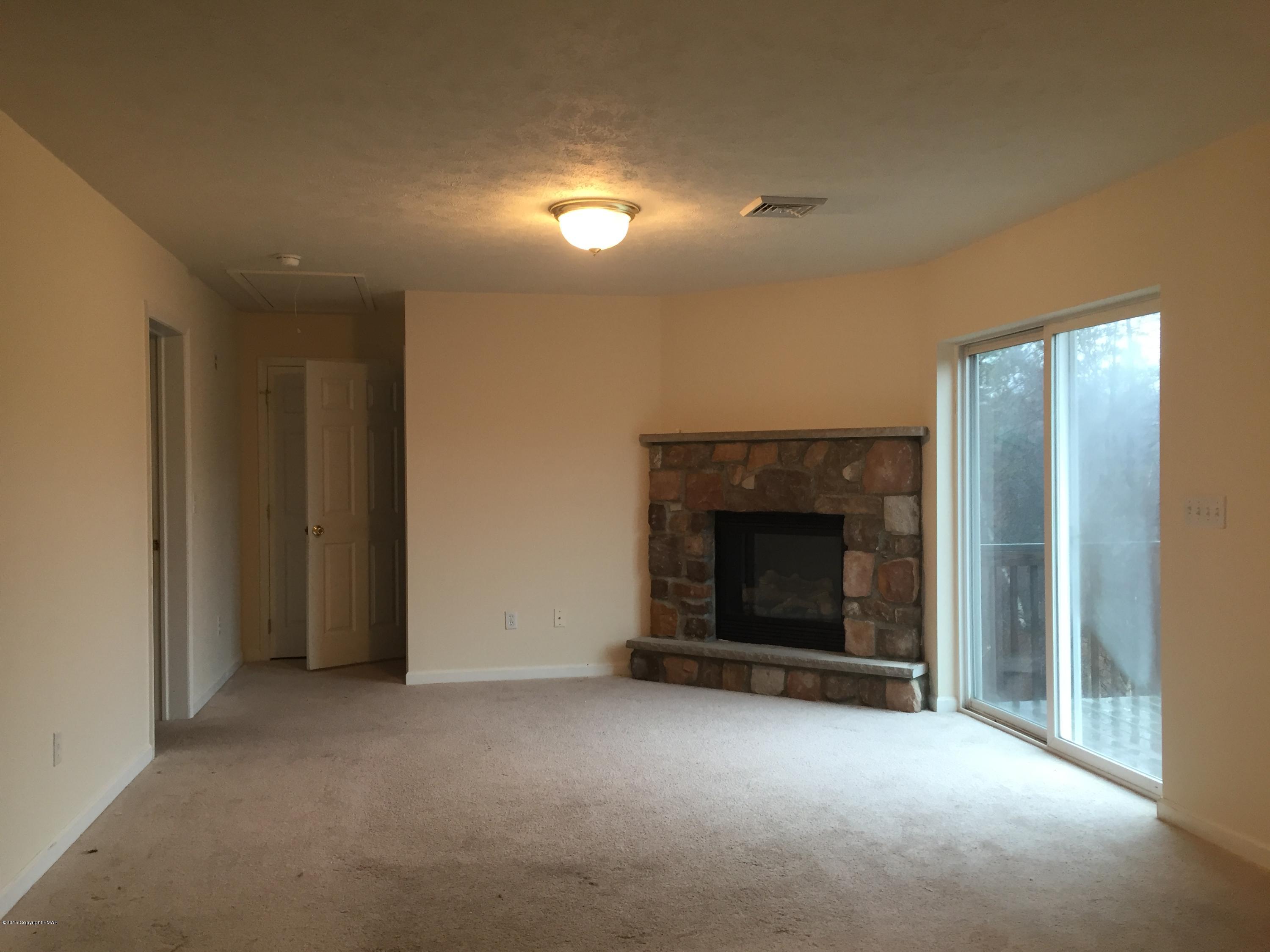 1653 Clover Road North Long Pond, PA 18334 - Photo 5 of 15 a view of a livingroom with a fireplace