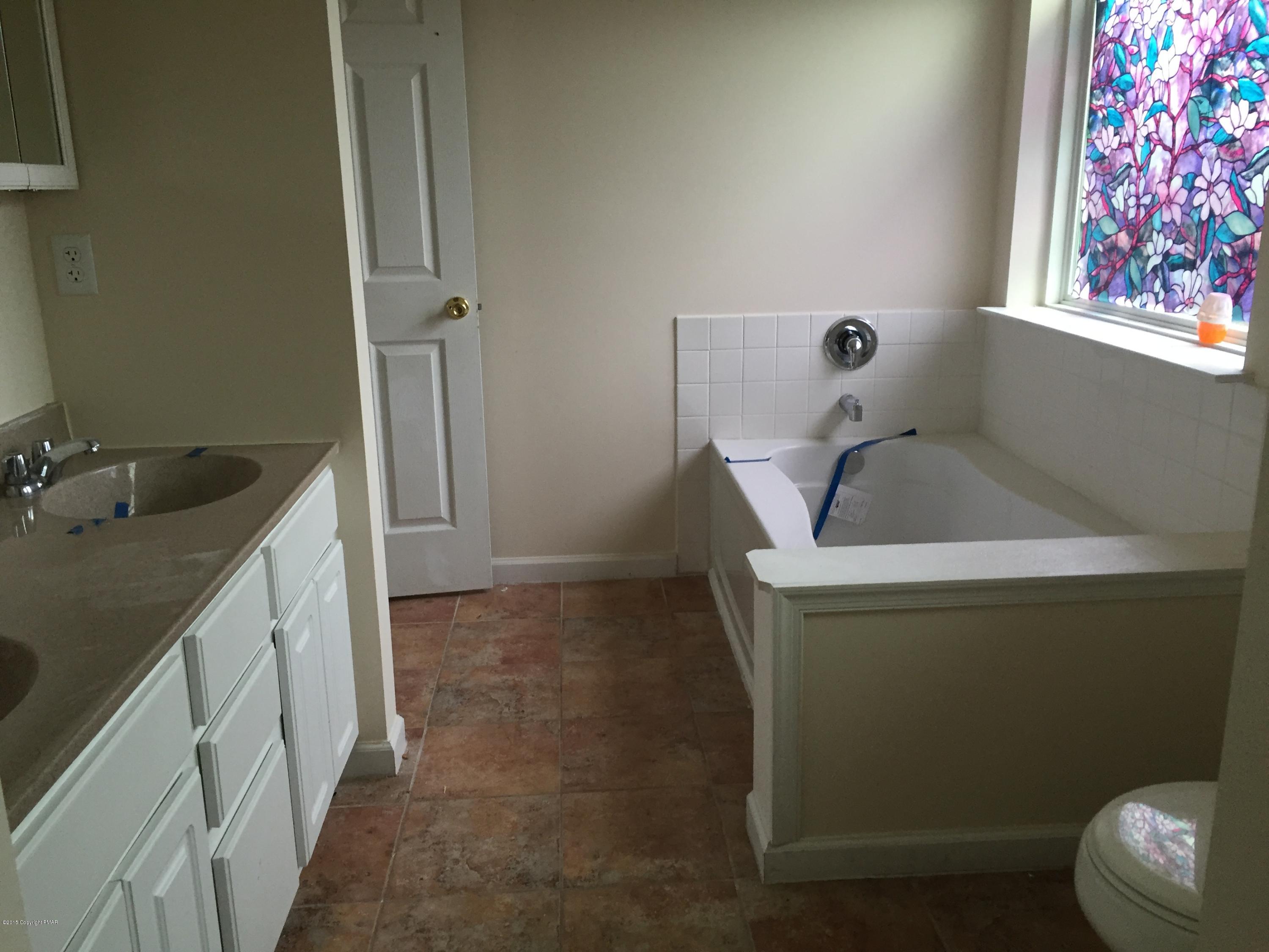 1653 Clover Road North Long Pond, PA 18334 - Photo 9 of 15 a bathroom with a sink and toilet