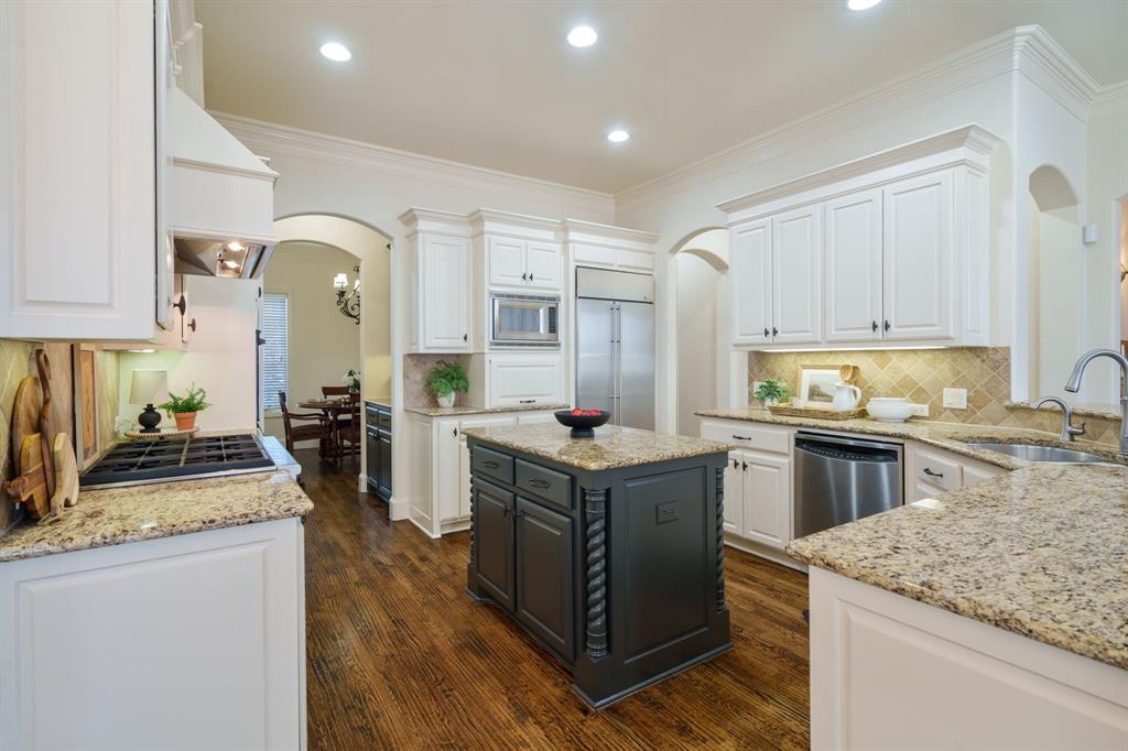 6724 Frankford Road Dallas, TX 75252 - Photo 12 of 40 a kitchen with granite countertop a stove oven and sink
