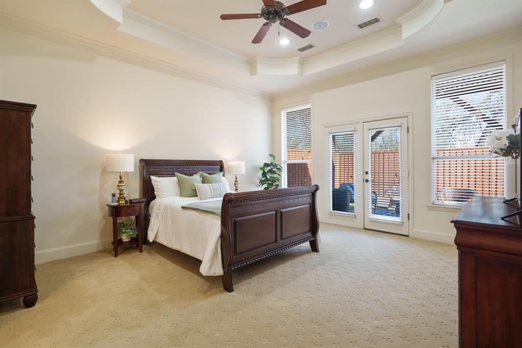 6724 Frankford Road Dallas, TX 75252 - Photo 21 of 40 a bed room with a bed and a chandelier