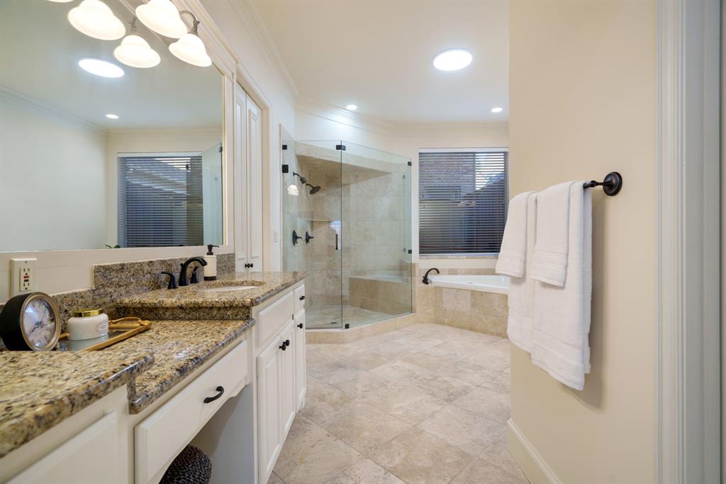 6724 Frankford Road Dallas, TX 75252 - Photo 23 of 40 a bathroom with a granite countertop sink a toilet and mirror