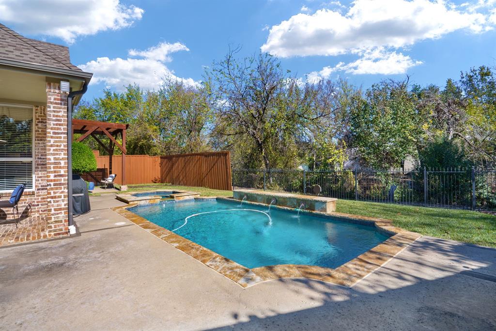 6724 Frankford Road Dallas, TX 75252 - Photo 36 of 40 a view of a swimming pool with a patio and a yard