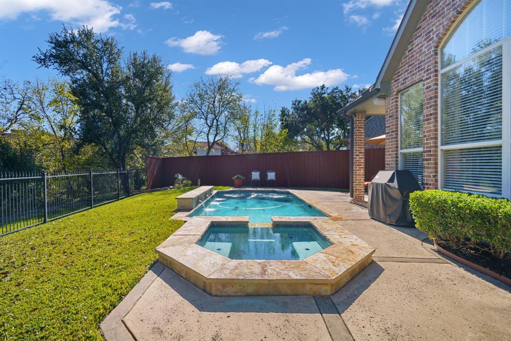 6724 Frankford Road Dallas, TX 75252 - Photo 39 of 40 a view of a backyard with swimming pool