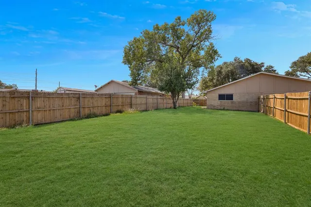 a view of a backyard with a garden