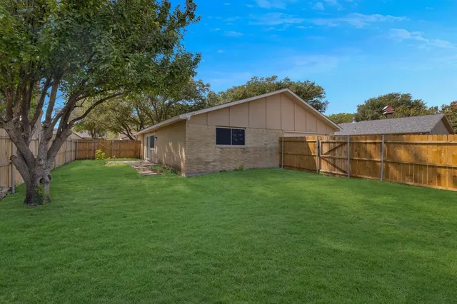 a view of a backyard with a garden