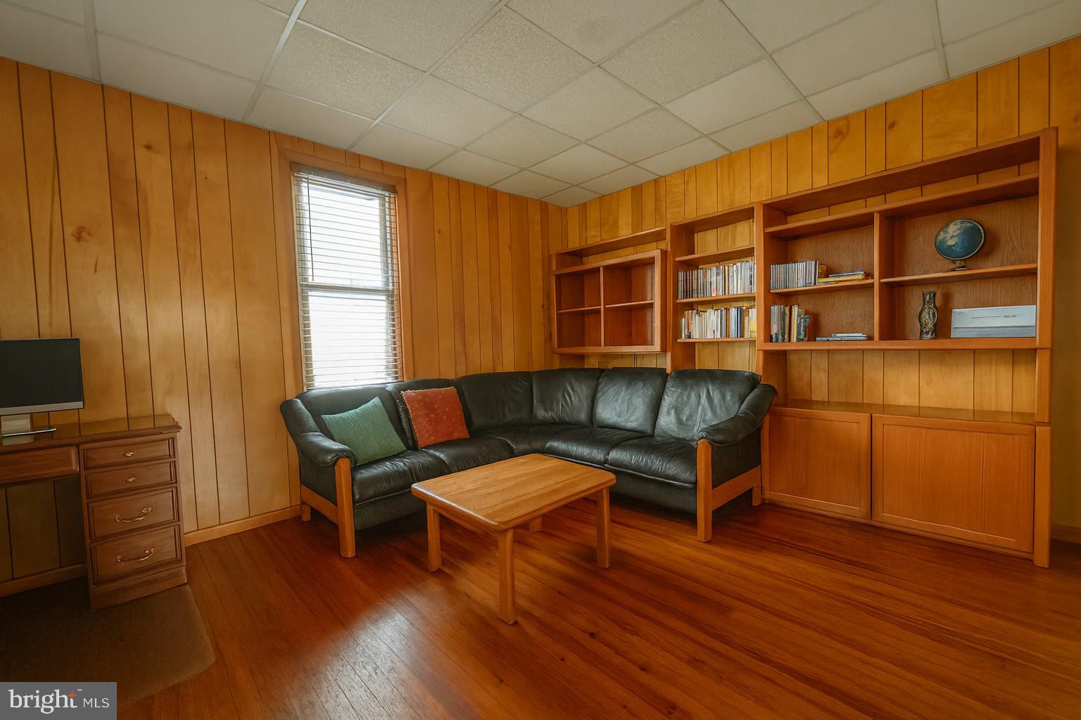 10128 Hummingbird Street Ellerslie, MD 21529 - Photo 5 of 21 a living room with furniture and a flat screen tv