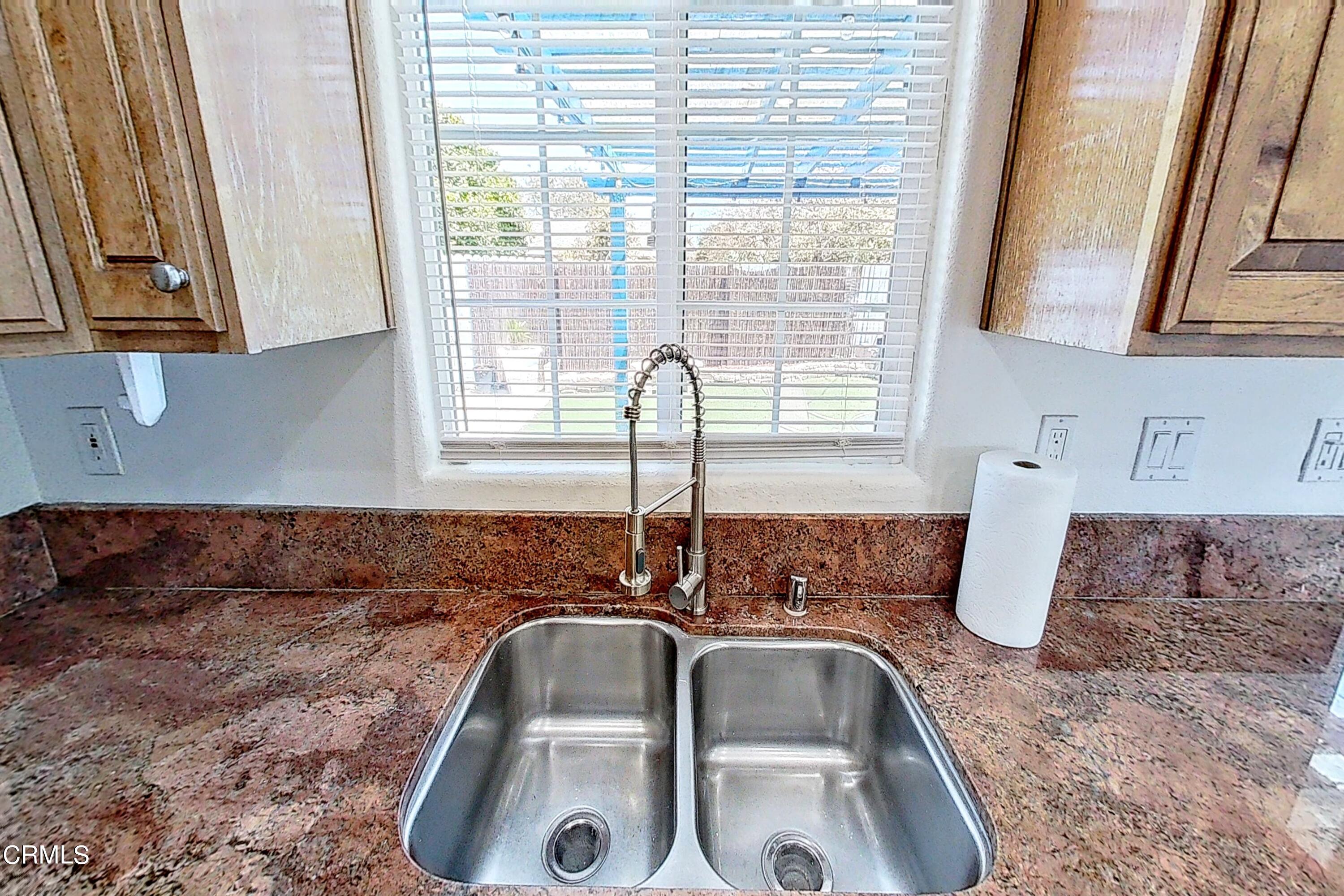 1830 Claremont Drive Oxnard, CA 93035 - Photo 12 of 36 a bathroom with a sink and a window
