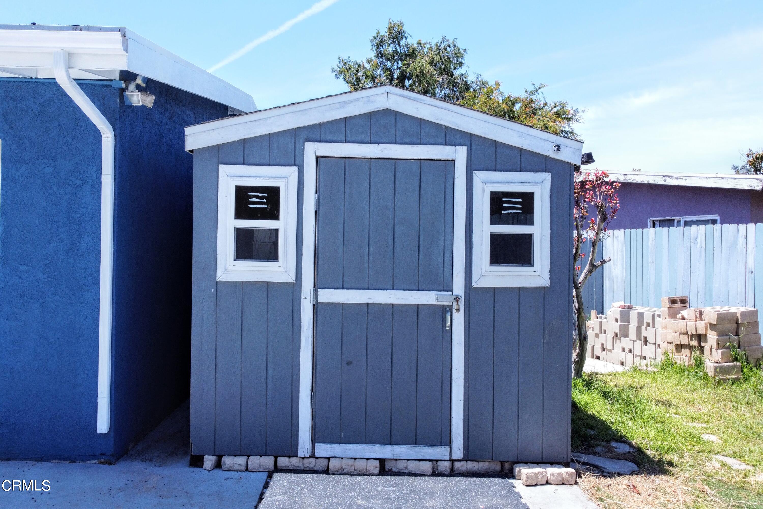 1830 Claremont Drive Oxnard, CA 93035 - Photo 31 of 36 a front view of a house with garden